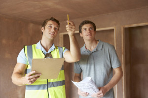 48849294 - builder and inspector looking at new property